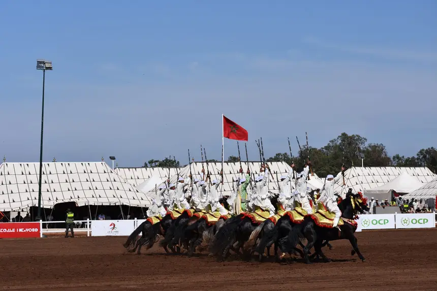 Tbourida fantasia print — Moroccan horsemen charging through gunpowder smoke (BWK-015), photograph by Saida
