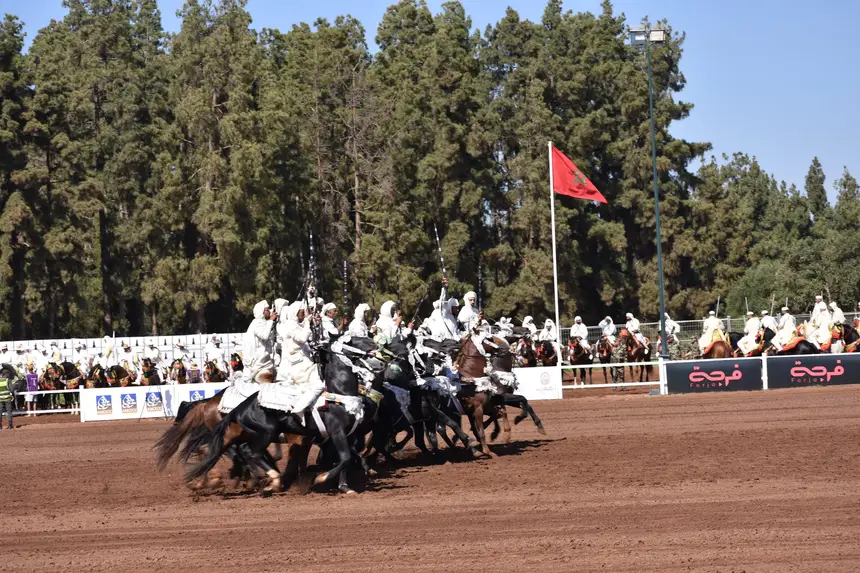 Tbourida fantasia print — Moroccan horsemen charging through gunpowder smoke (BWK-019), photograph by Saida