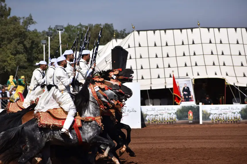 Tbourida fantasia print — Moroccan horsemen charging through gunpowder smoke (BWK-021), photograph by Saida