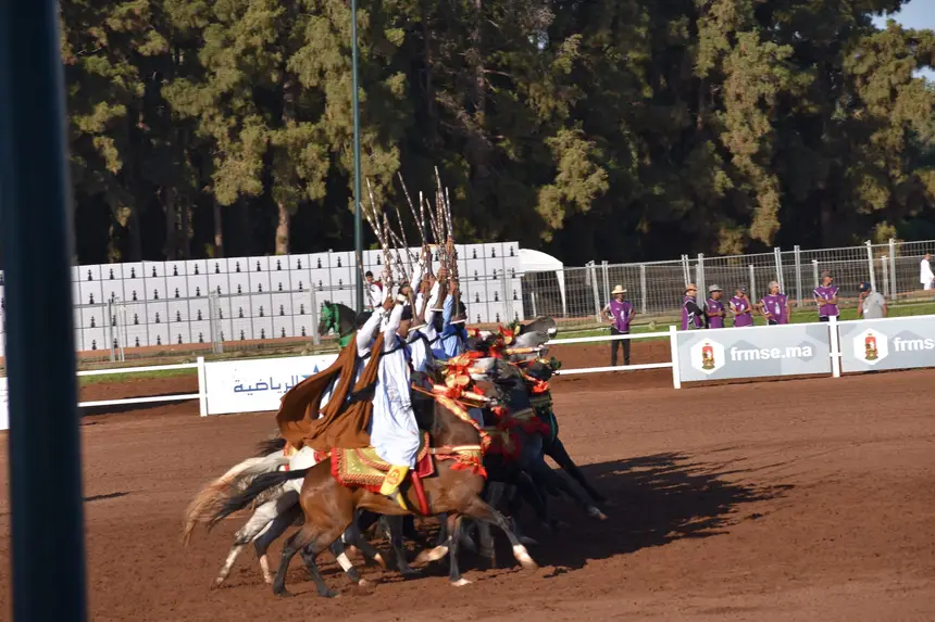 Tbourida fantasia print — Moroccan horsemen charging through gunpowder smoke (BWK-028), photograph by Saida