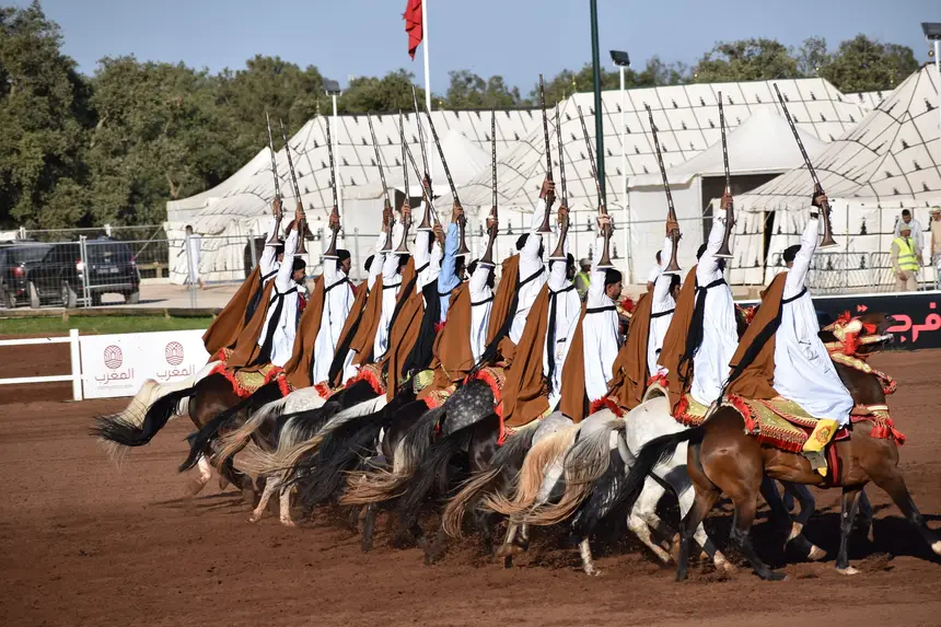 Tbourida fantasia print — Moroccan horsemen charging through gunpowder smoke (BWK-029), photograph by Saida