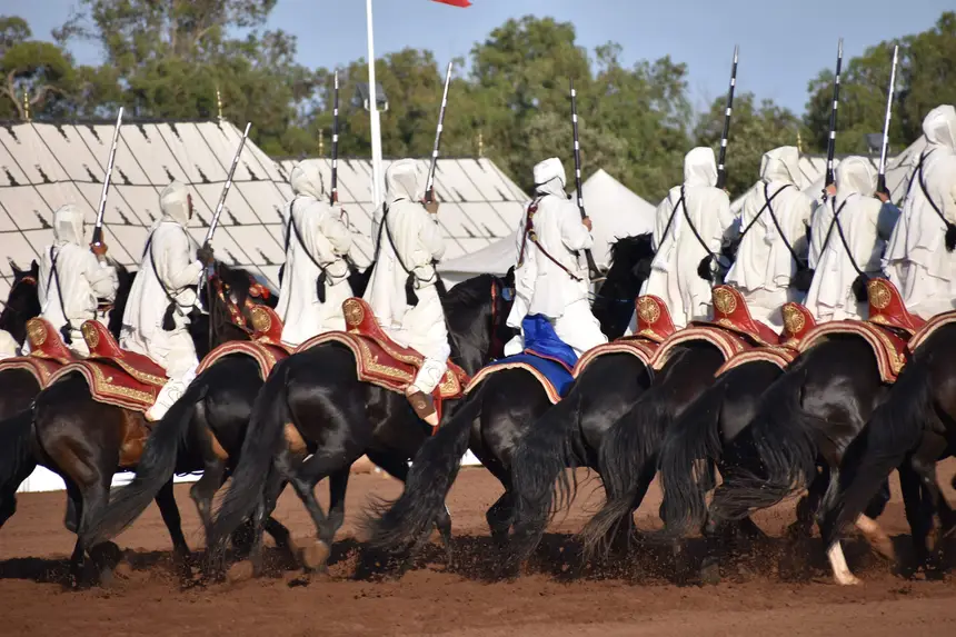 Tbourida fantasia print — Moroccan horsemen charging through gunpowder smoke (BWK-033), photograph by Saida