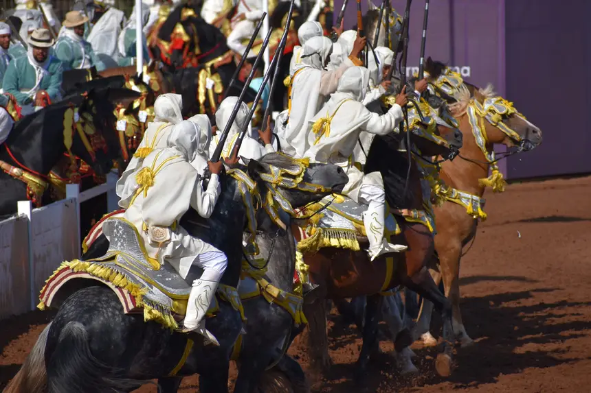 Tbourida fantasia print — Moroccan horsemen charging through gunpowder smoke (BWK-043), photograph by Saida
