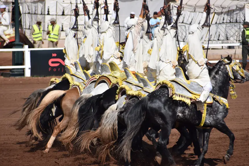 Tbourida fantasia print — Moroccan horsemen charging through gunpowder smoke (BWK-044), photograph by Saida