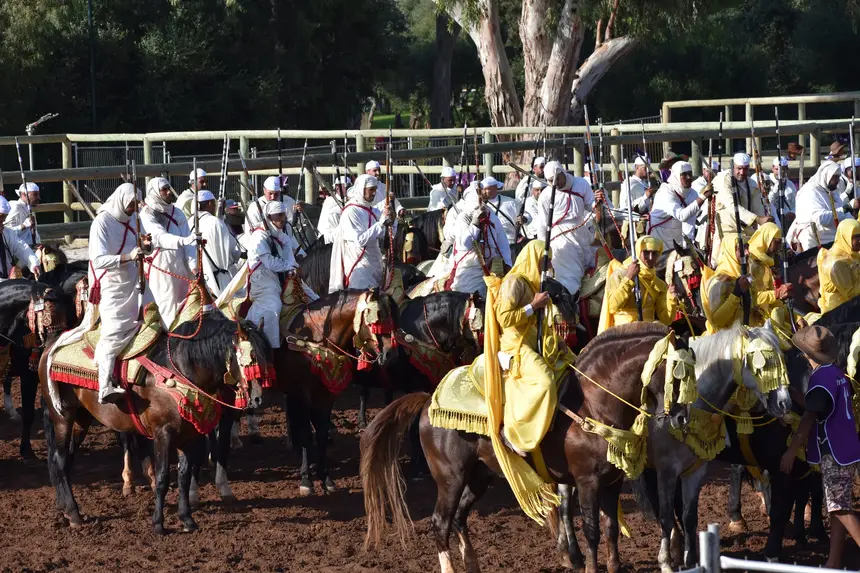 Tbourida fantasia print — Moroccan horsemen charging through gunpowder smoke (BWK-051), photograph by Saida