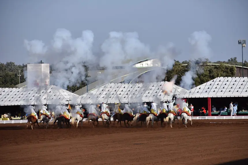 Tbourida fantasia print — Moroccan horsemen charging through gunpowder smoke (BWK-056), photograph by Saida
