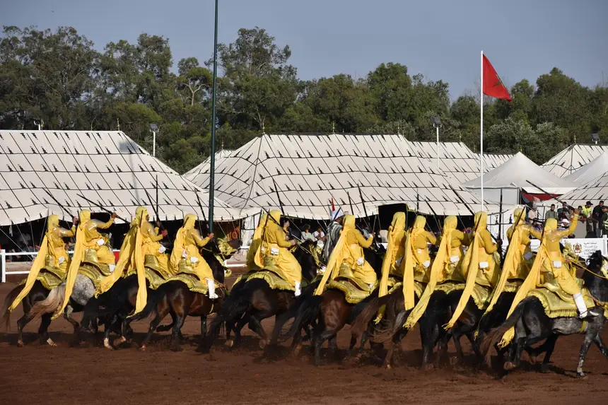 Tbourida fantasia print — Moroccan horsemen charging through gunpowder smoke (BWK-057), photograph by Saida