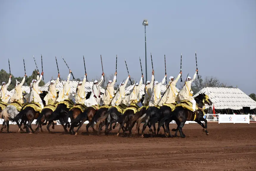 Tbourida fantasia print — Moroccan horsemen charging through gunpowder smoke (BWK-060), photograph by Saida