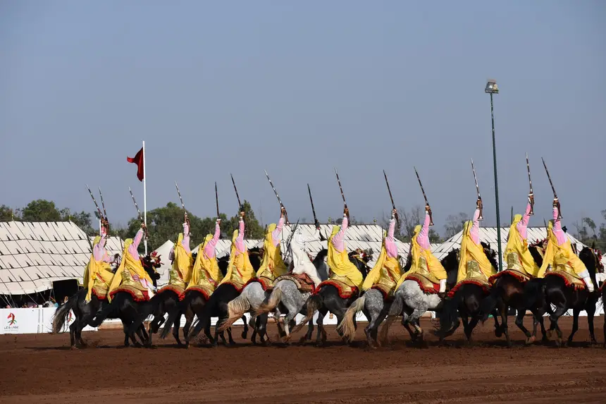 Tbourida fantasia print — Moroccan horsemen charging through gunpowder smoke (BWK-062), photograph by Saida