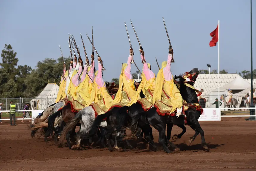 Tbourida fantasia print — Moroccan horsemen charging through gunpowder smoke (BWK-064), photograph by Saida