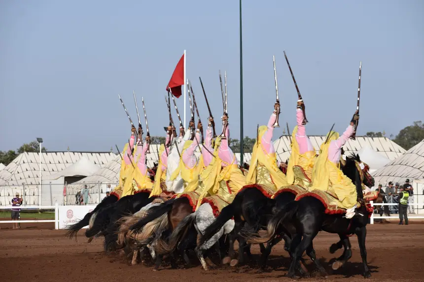 Tbourida fantasia print — Moroccan horsemen charging through gunpowder smoke (BWK-065), photograph by Saida