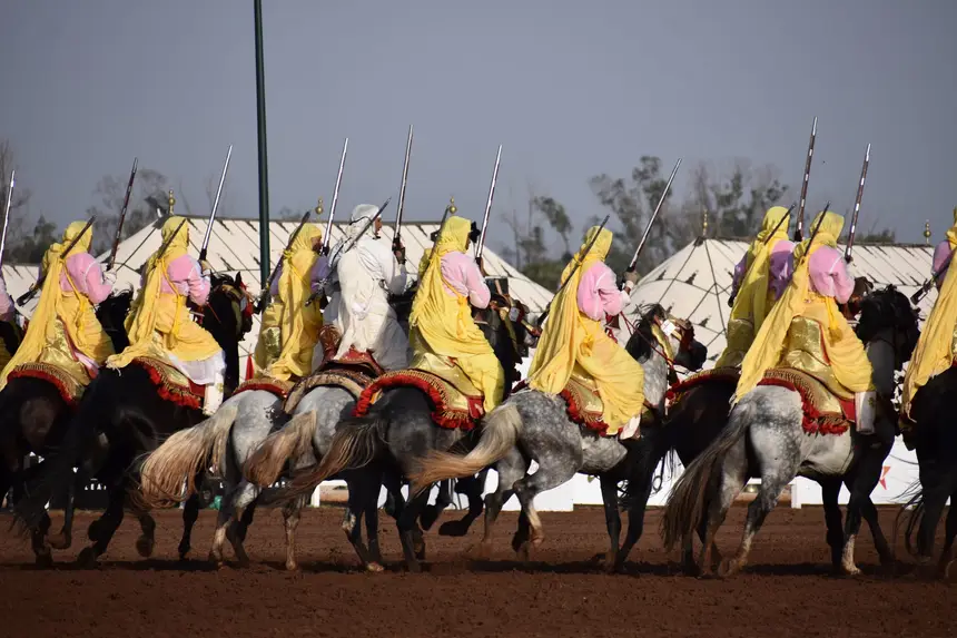 Tbourida fantasia print — Moroccan horsemen charging through gunpowder smoke (BWK-066), photograph by Saida