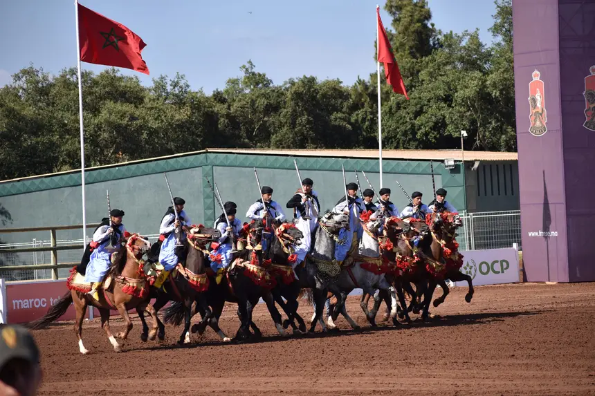 Tbourida fantasia print — Moroccan horsemen charging through gunpowder smoke (BWK-073), photograph by Saida