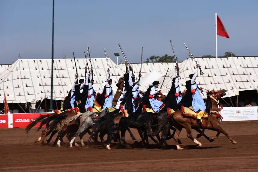 Tbourida fantasia print — Moroccan horsemen charging through gunpowder smoke (BWK-074), photograph by Saida