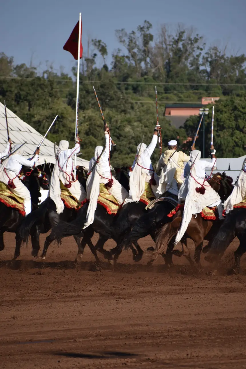 Tbourida fantasia print — Moroccan horsemen charging through gunpowder smoke (BWK-084), photograph by Saida