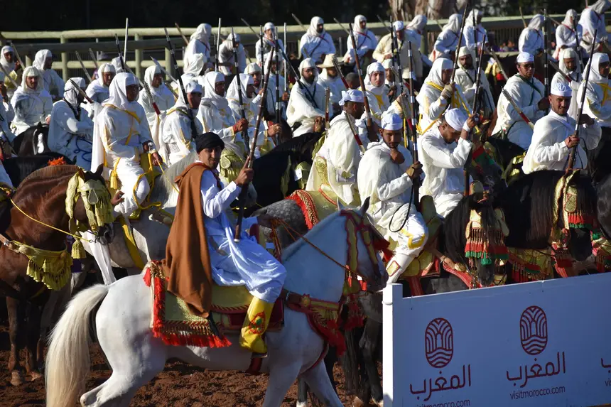 Tbourida fantasia print — Moroccan horsemen charging through gunpowder smoke (BWK-091), photograph by Saida