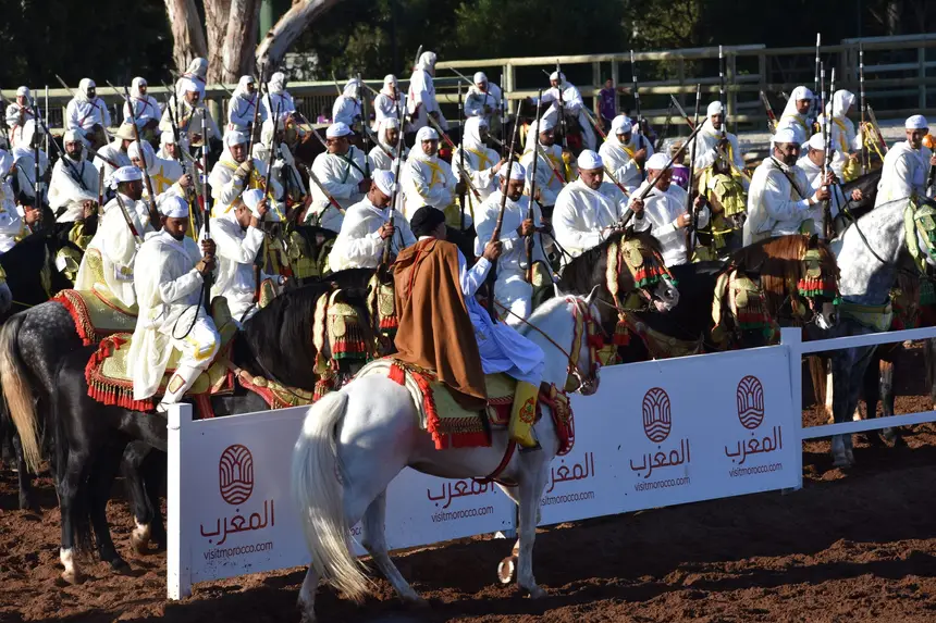 Tbourida fantasia print — Moroccan horsemen charging through gunpowder smoke (BWK-092), photograph by Saida