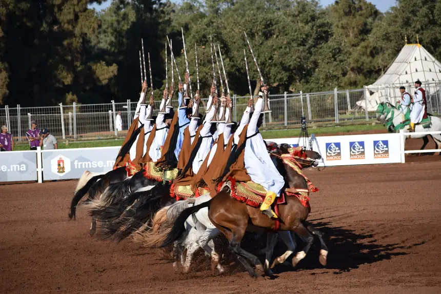 Tbourida fantasia print — Moroccan horsemen charging through gunpowder smoke (BWK-096), photograph by Saida