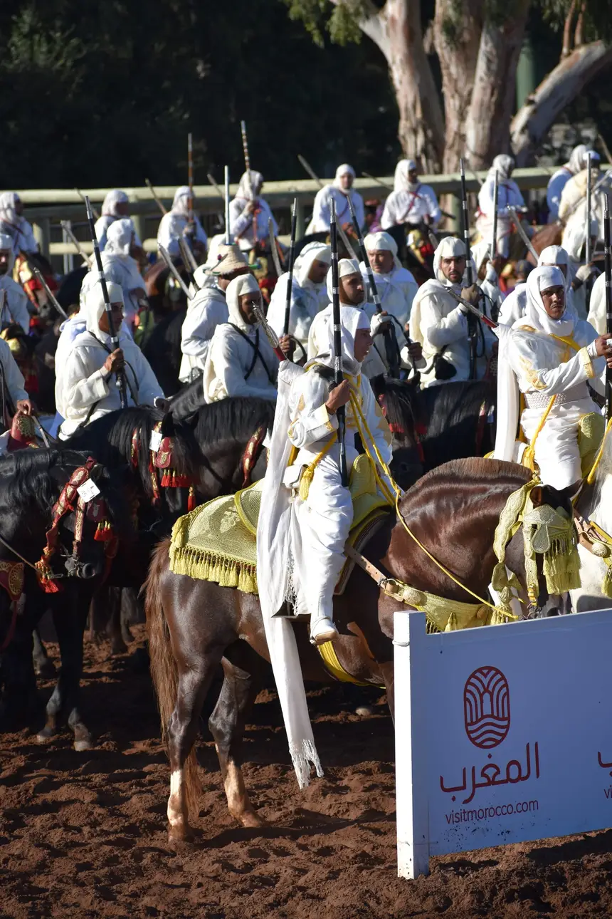 Tbourida fantasia print — Moroccan horsemen charging through gunpowder smoke (BWK-100), photograph by Saida