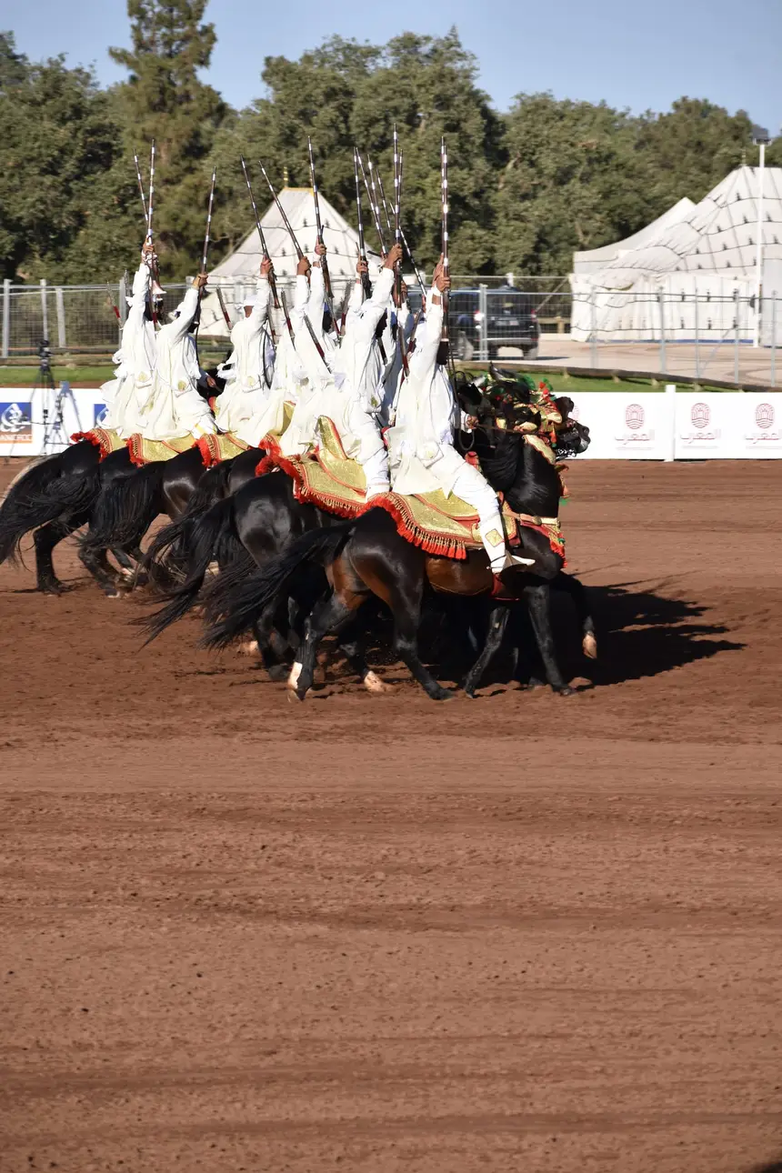 Tbourida fantasia print — Moroccan horsemen charging through gunpowder smoke (BWK-105), photograph by Saida