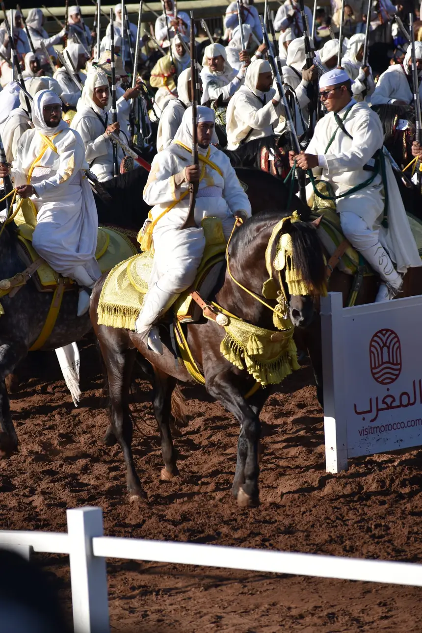 Tbourida fantasia print — Moroccan horsemen charging through gunpowder smoke (BWK-111), photograph by Saida