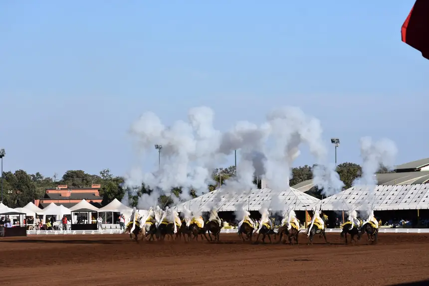 Tbourida fantasia print — Moroccan horsemen charging through gunpowder smoke (BWK-113), photograph by Saida