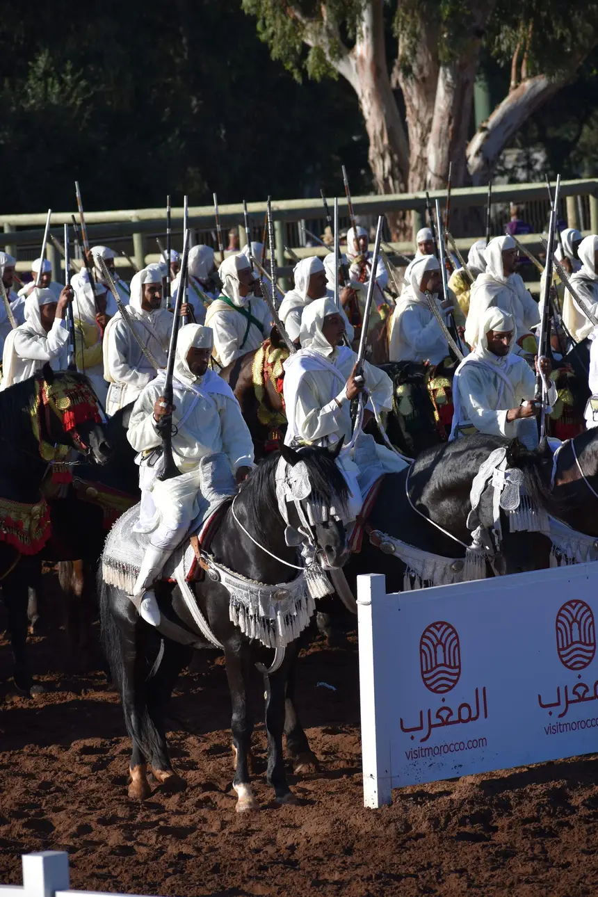 Tbourida fantasia print — Moroccan horsemen charging through gunpowder smoke (BWK-116), photograph by Saida