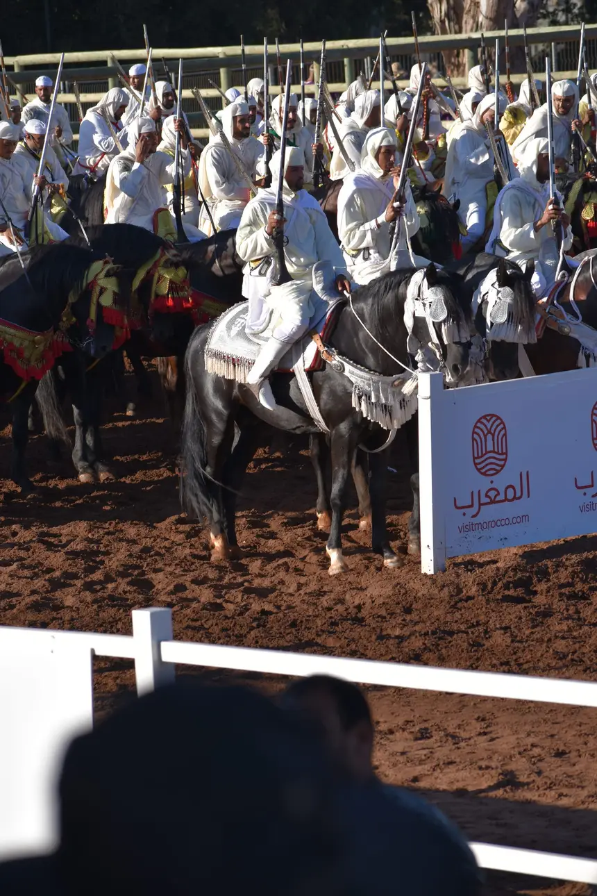 Tbourida fantasia print — Moroccan horsemen charging through gunpowder smoke (BWK-118), photograph by Saida