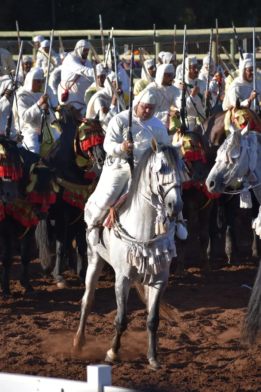 Tbourida fantasia print — Moroccan horsemen charging through gunpowder smoke (BWK-122), photograph by Saida