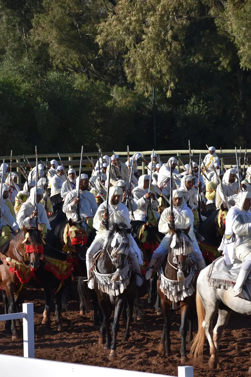 Tbourida fantasia print — Moroccan horsemen charging through gunpowder smoke (BWK-125), photograph by Saida