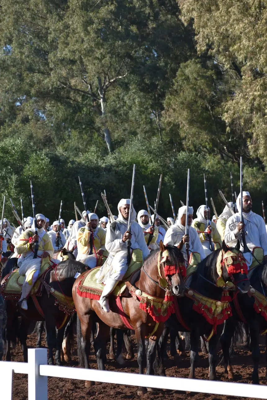 Tbourida fantasia print — Moroccan horsemen charging through gunpowder smoke (BWK-129), photograph by Saida