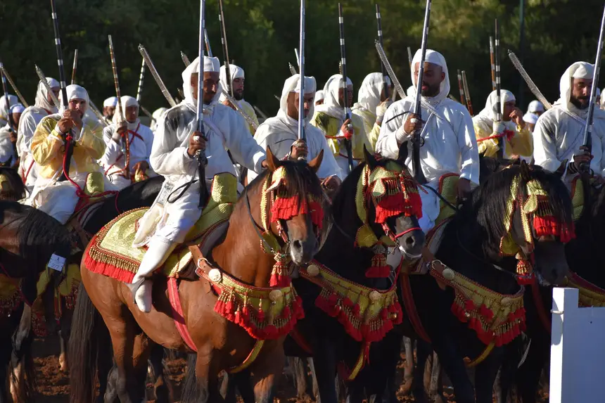 Tbourida fantasia print — Moroccan horsemen charging through gunpowder smoke (BWK-133), photograph by Saida