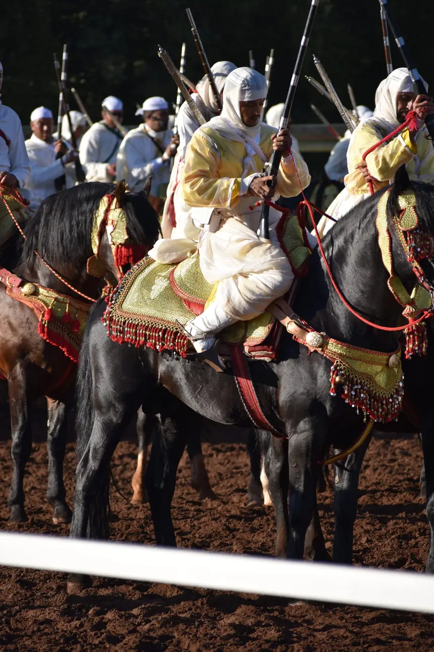 Tbourida fantasia print — Moroccan horsemen charging through gunpowder smoke (BWK-136), photograph by Saida