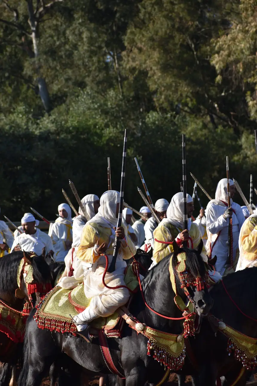 Tbourida fantasia print — Moroccan horsemen charging through gunpowder smoke (BWK-137), photograph by Saida