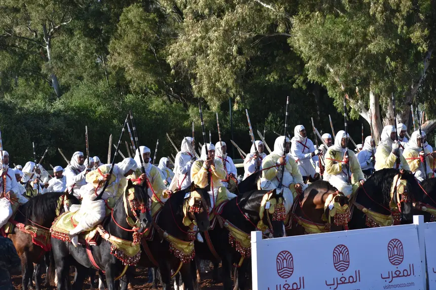 Tbourida fantasia print — Moroccan horsemen charging through gunpowder smoke (BWK-138), photograph by Saida