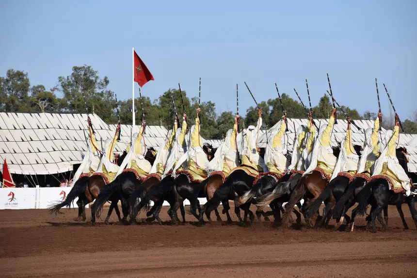 Tbourida fantasia print — Moroccan horsemen charging through gunpowder smoke (BWK-149), photograph by Saida