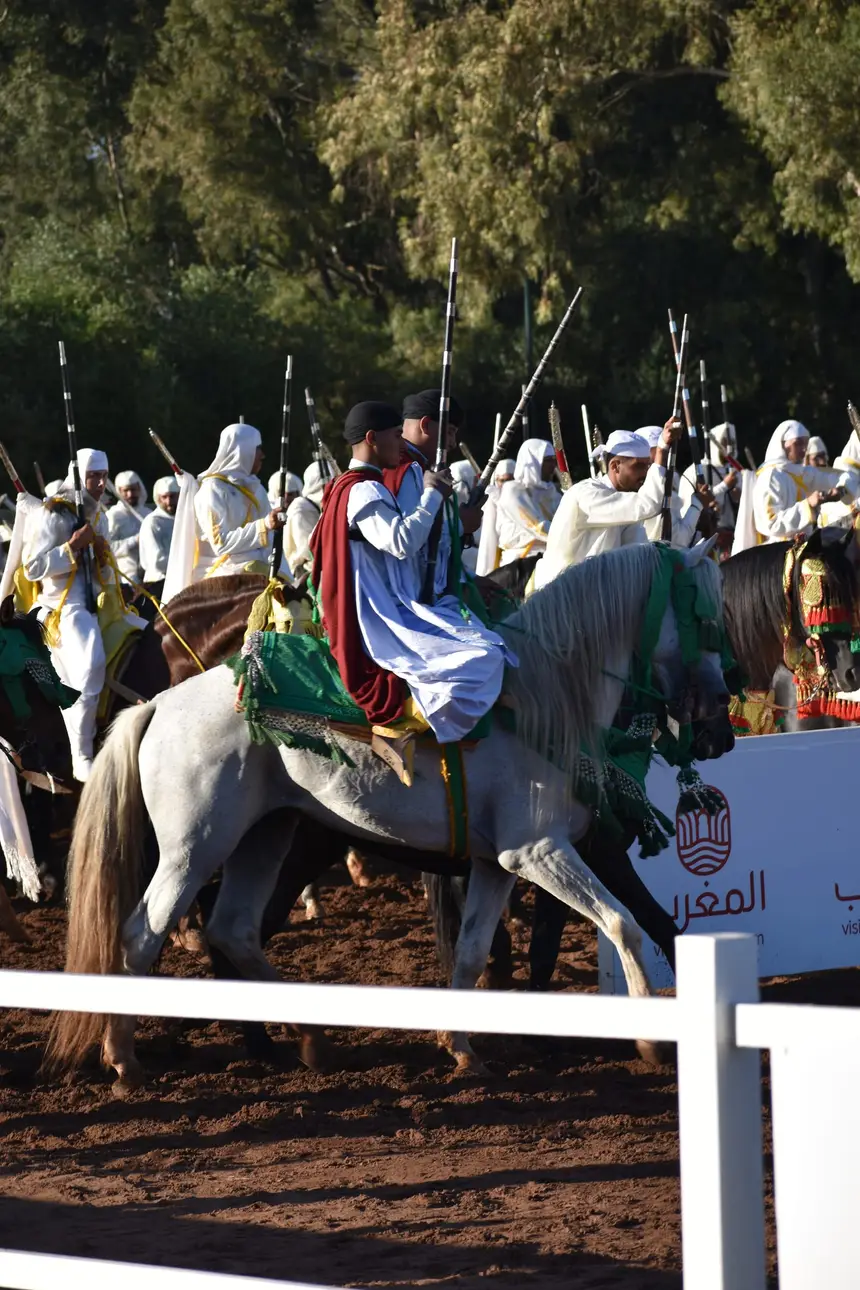 Tbourida fantasia print — Moroccan horsemen charging through gunpowder smoke (BWK-158), photograph by Saida