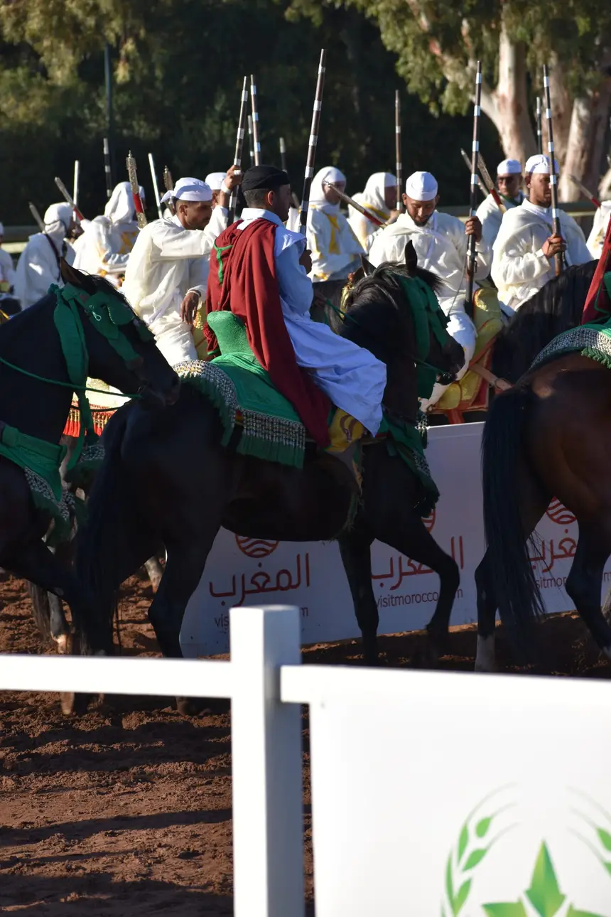 Tbourida fantasia print — Moroccan horsemen charging through gunpowder smoke (BWK-159), photograph by Saida