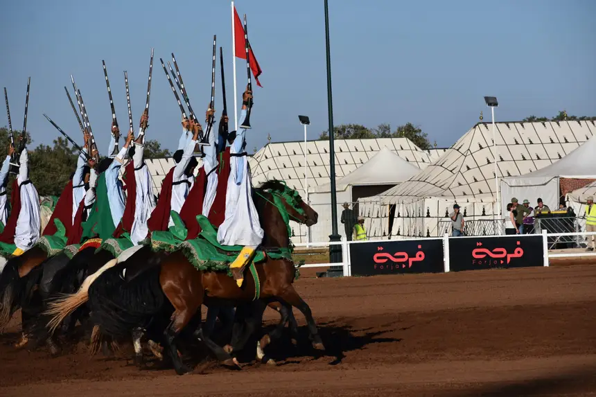 Tbourida fantasia print — Moroccan horsemen charging through gunpowder smoke (BWK-162), photograph by Saida