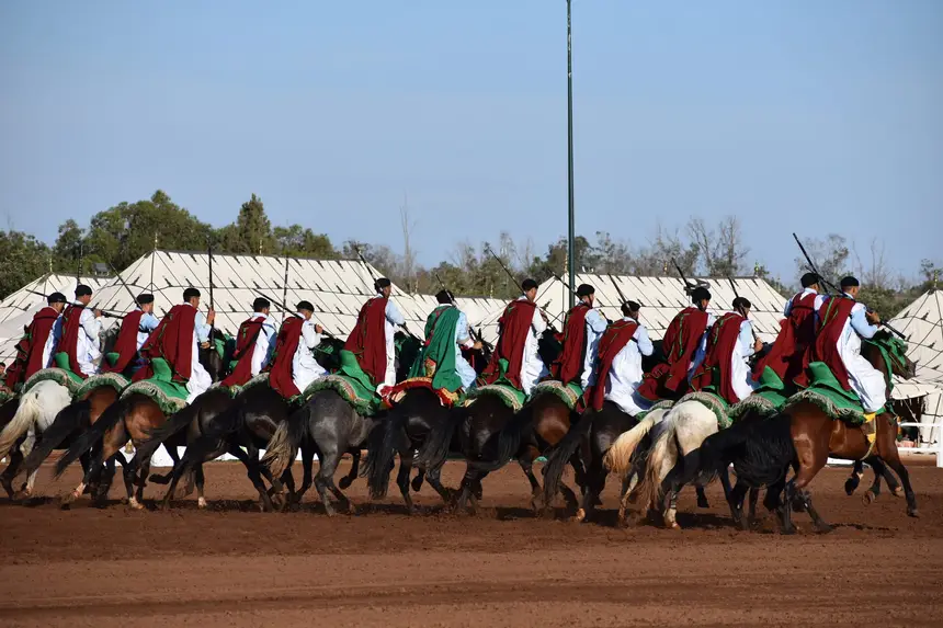 Tbourida fantasia print — Moroccan horsemen charging through gunpowder smoke (BWK-164), photograph by Saida