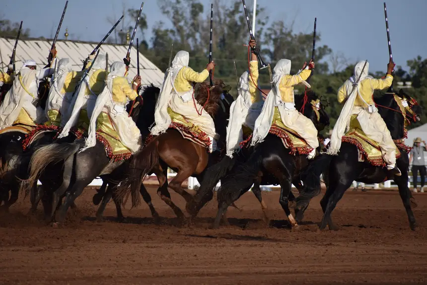Tbourida fantasia print — Moroccan horsemen charging through gunpowder smoke (BWK-197), photograph by Saida