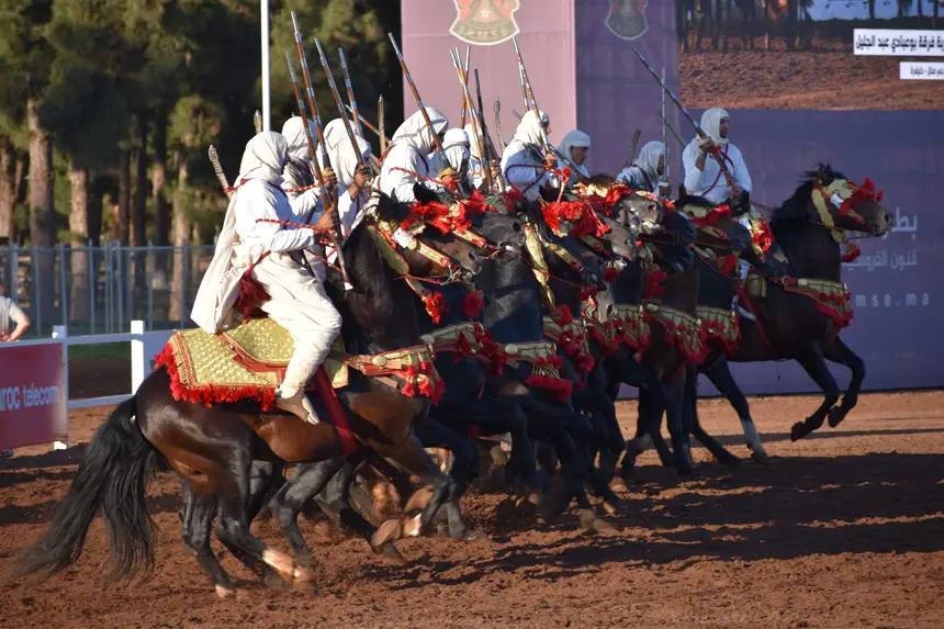 Tbourida fantasia print — Moroccan horsemen charging through gunpowder smoke (BWK-201), photograph by Saida