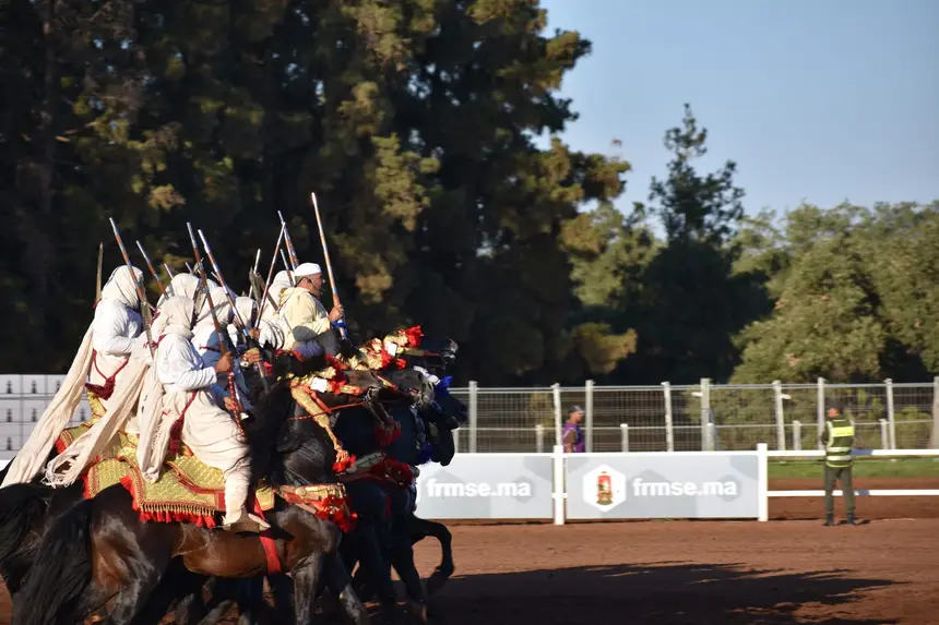 Tbourida fantasia print — Moroccan horsemen charging through gunpowder smoke (BWK-202), photograph by Saida