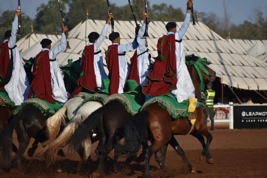 Tbourida fantasia print — Moroccan horsemen charging through gunpowder smoke (BWK-209), photograph by Saida
