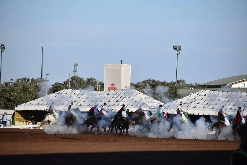 Tbourida fantasia print — Moroccan horsemen charging through gunpowder smoke (BWK-211), photograph by Saida