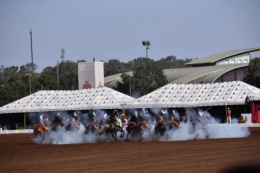 Tbourida fantasia print — Moroccan horsemen charging through gunpowder smoke (BWK-247), photograph by Saida