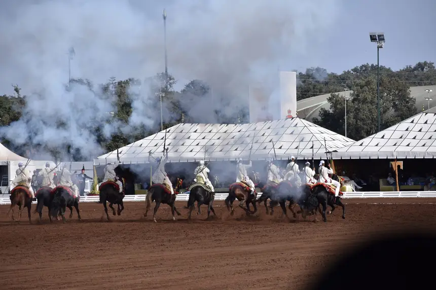 Tbourida fantasia print — Moroccan horsemen charging through gunpowder smoke (BWK-252), photograph by Saida