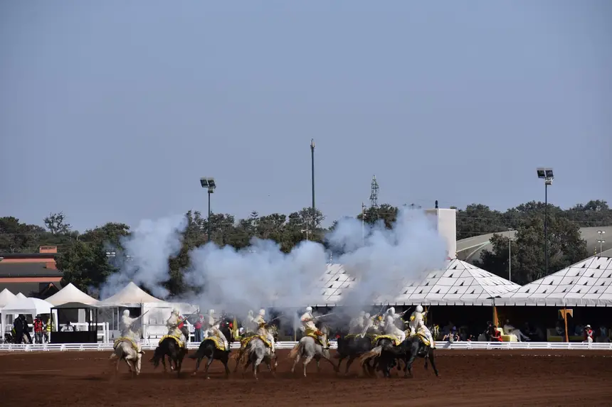 Tbourida fantasia print — Moroccan horsemen charging through gunpowder smoke (BWK-254), photograph by Saida