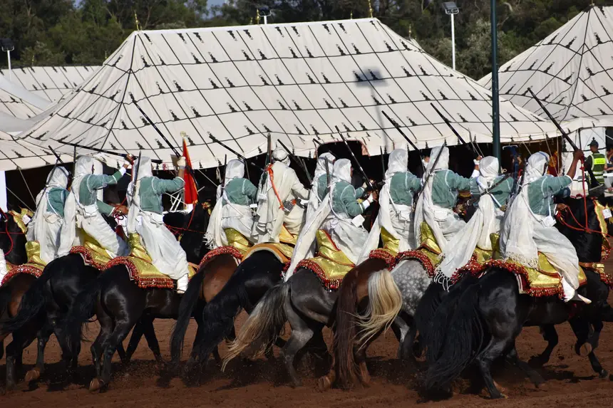 Tbourida fantasia print — Moroccan horsemen charging through gunpowder smoke (BWK-271), photograph by Saida