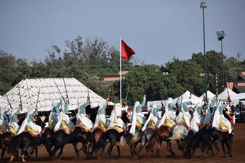 Tbourida fantasia print — Moroccan horsemen charging through gunpowder smoke (BWK-272), photograph by Saida